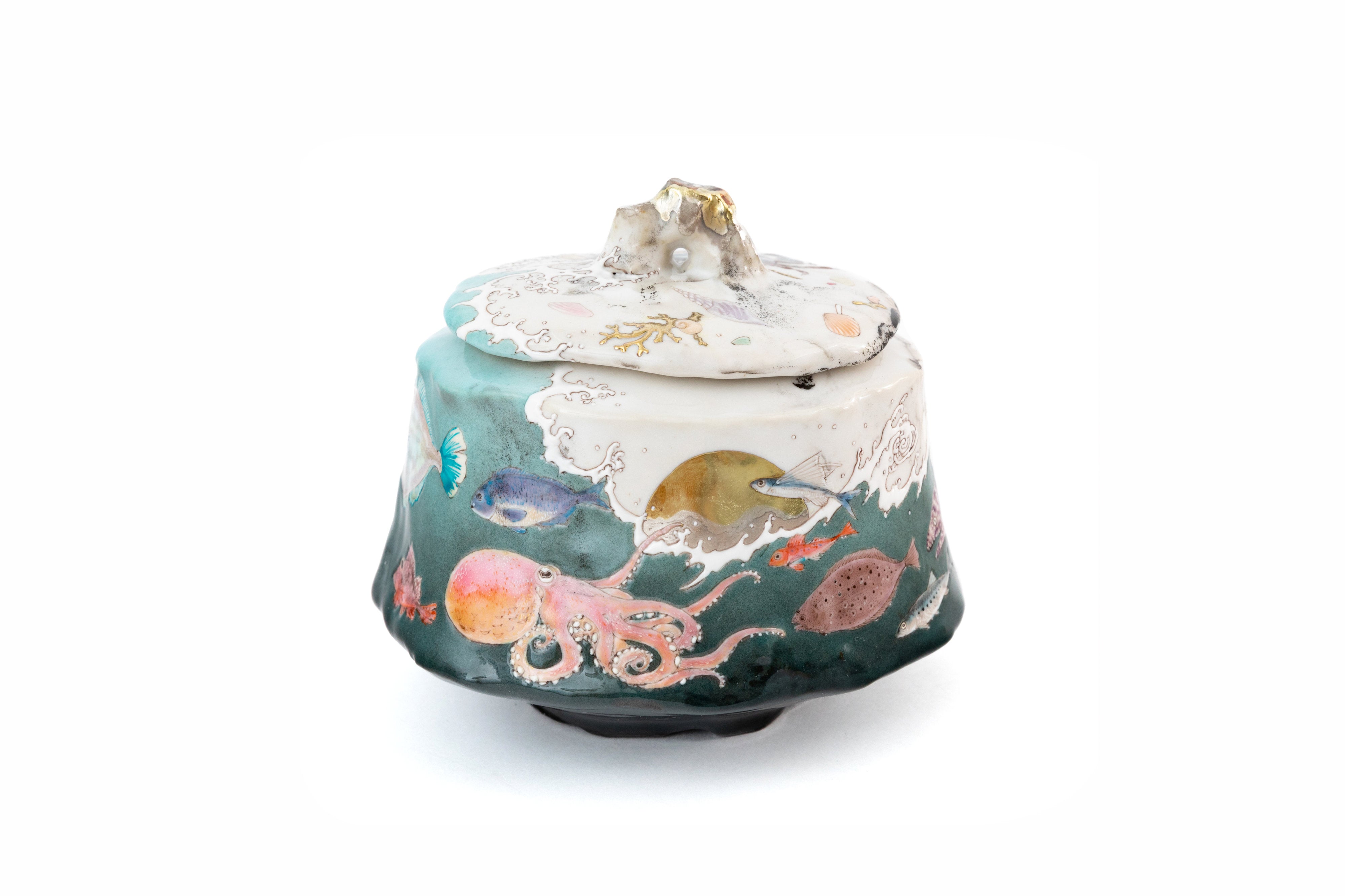Lidded container with a design of white waves and a school of fish [lo